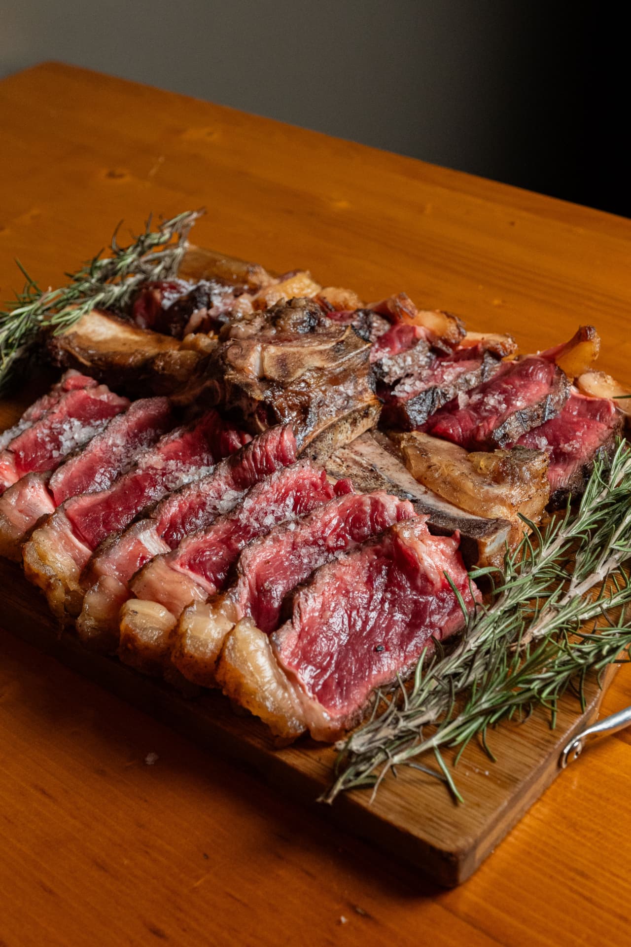 Sliced dry-aged steak with rosemary